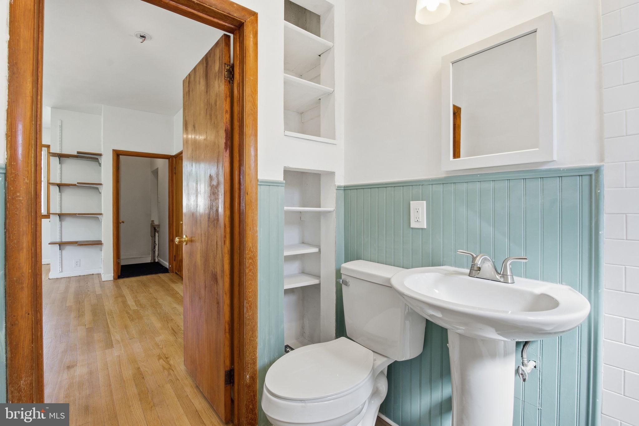 2301 Bayside Drive Baltimore, MD 21221 - Photo 25 of 35 a bathroom with a sink toilet and shower