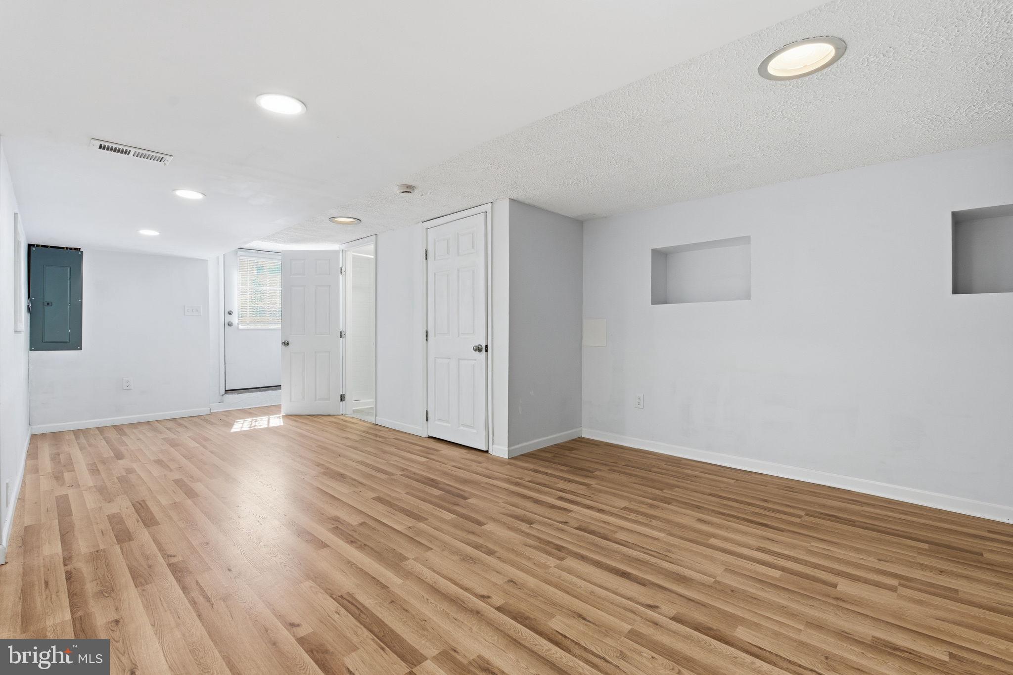 2301 Bayside Drive Baltimore, MD 21221 - Photo 5 of 35 a view of an empty room with wooden floor