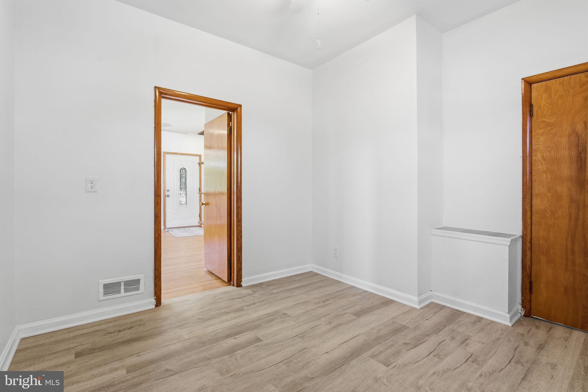 2301 Bayside Drive Baltimore, MD 21221 - Photo 8 of 35 an empty room with wooden floor and closet