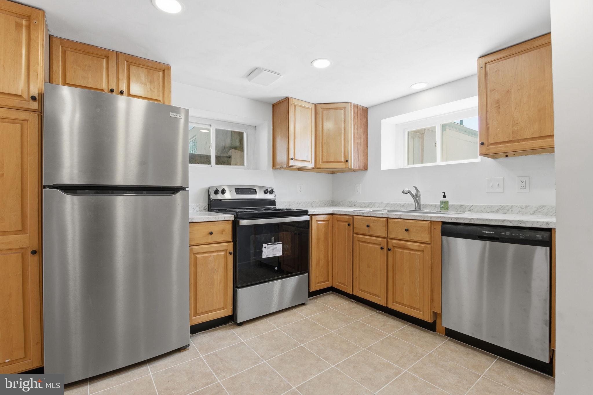 2301 Bayside Drive Baltimore, MD 21221 - Photo 9 of 35 a kitchen with stainless steel appliances granite countertop a refrigerator and a sink