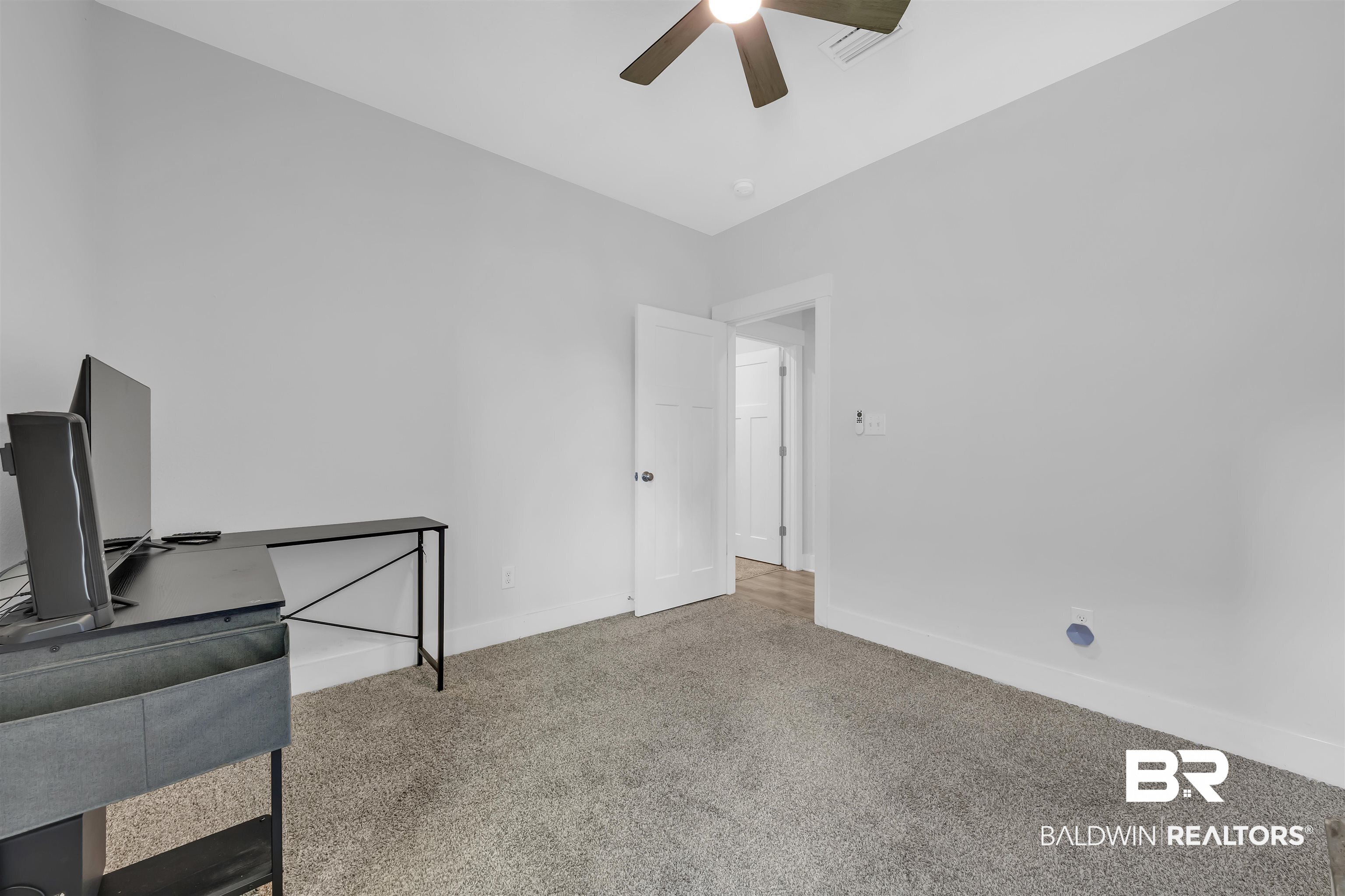 16504 Prado Loop Loxley, AL 36551 - Photo 32 of 45 Unfurnished office with light colored carpet and ceiling fan