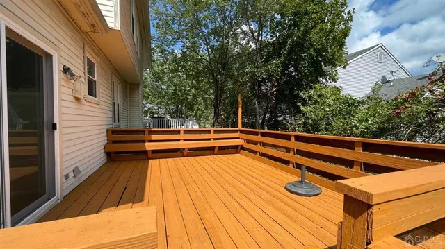 a view of balcony with two chairs and potted plants