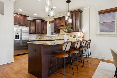 a view of an empty room with a ceiling fan