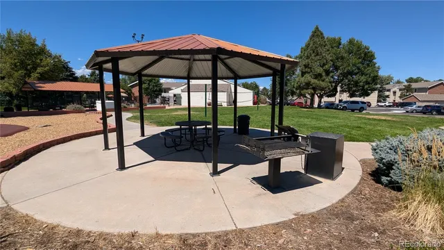 a view of outdoor space with playground and green space