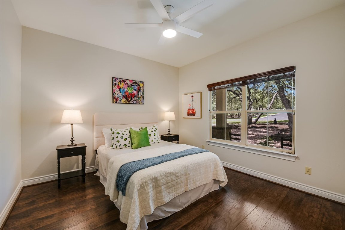 524 Highland Spring Lane Georgetown, TX 78633 - Photo 17 of 39 a bedroom with a bed and a large window