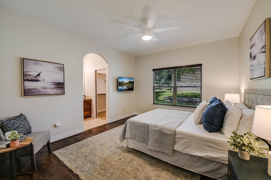 524 Highland Spring Lane Georgetown, TX 78633 - Photo 20 of 39 a bedroom with a bed and wooden floor