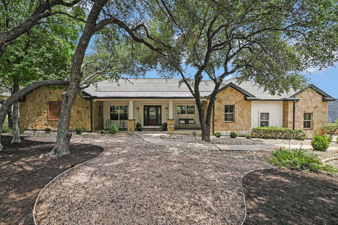 524 Highland Spring Lane Georgetown, TX 78633 - Photo 2 of 39 a front view of a house with a garden