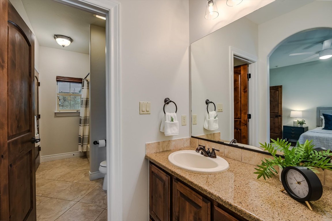 524 Highland Spring Lane Georgetown, TX 78633 - Photo 21 of 39 a bathroom with a granite countertop sink and a mirror