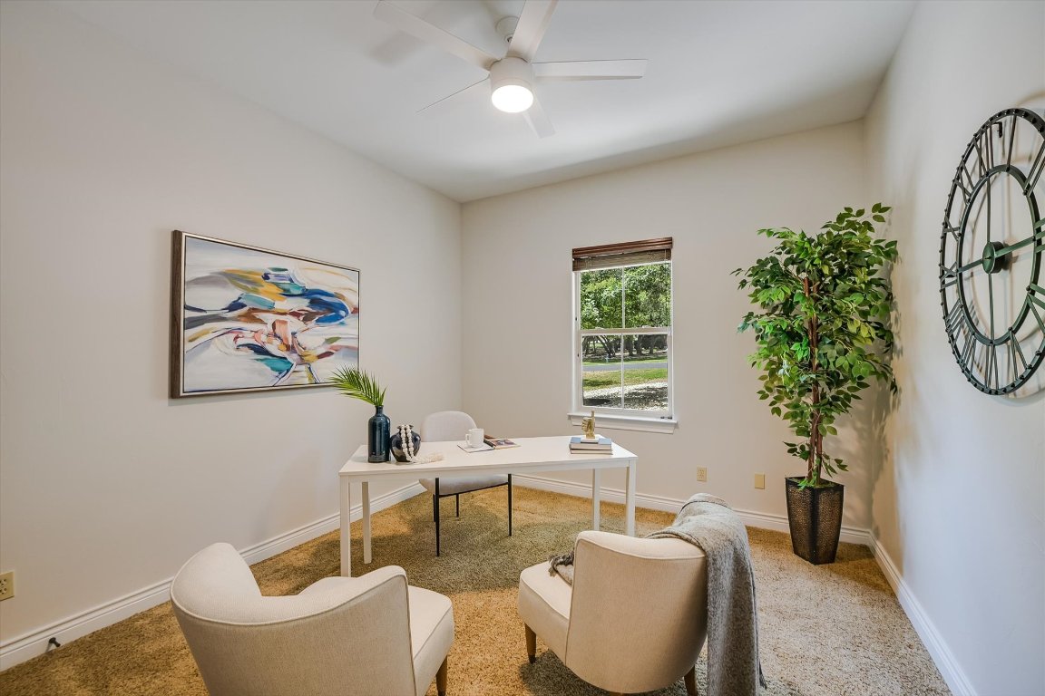 524 Highland Spring Lane Georgetown, TX 78633 - Photo 22 of 39 a living room with furniture a window and a potted plant