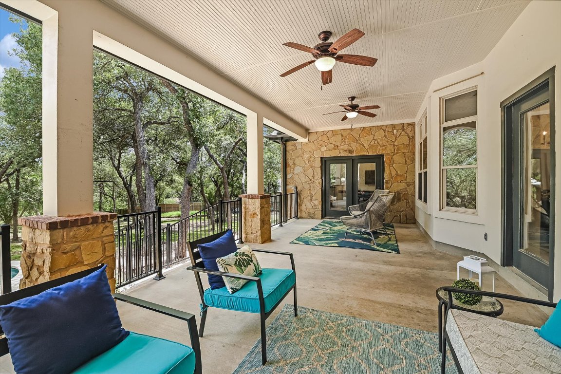 524 Highland Spring Lane Georgetown, TX 78633 - Photo 27 of 39 a living room with furniture ceiling fan and a large window