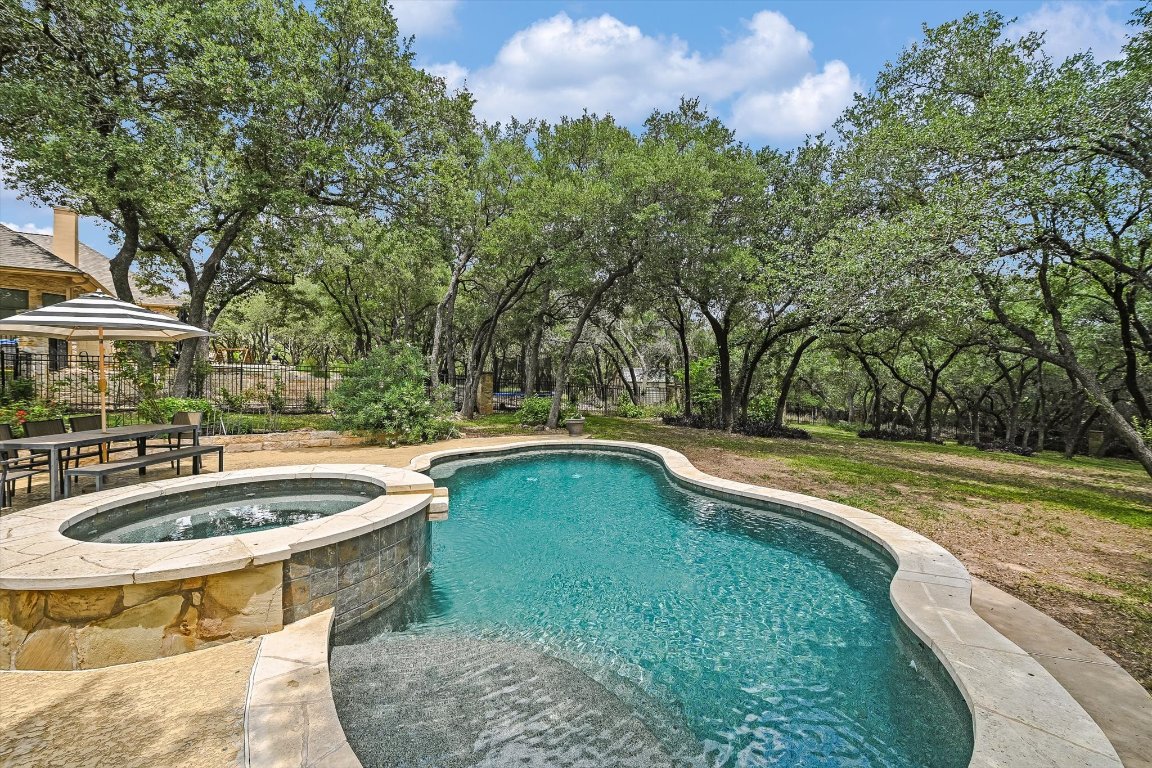 524 Highland Spring Lane Georgetown, TX 78633 - Photo 28 of 39 a view of a swimming pool with a yard