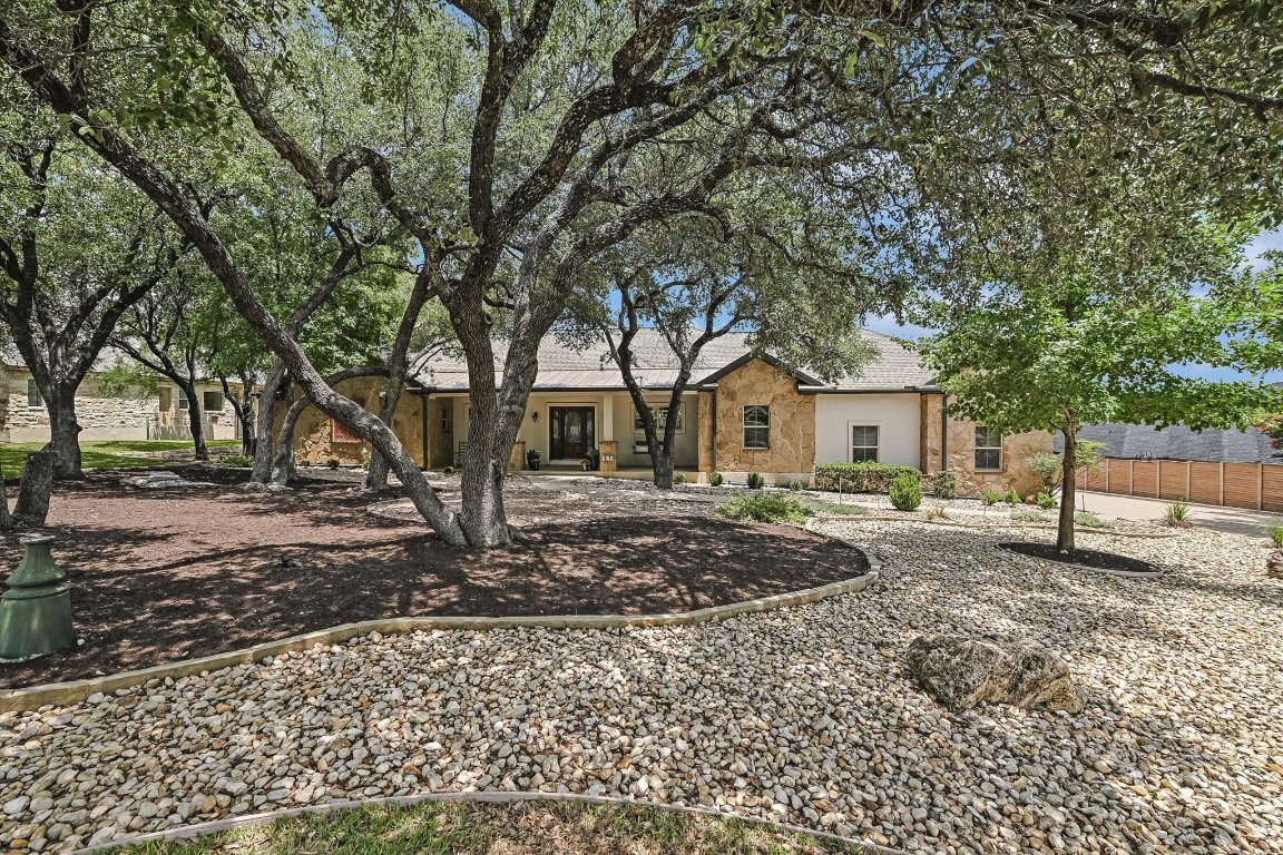 524 Highland Spring Lane Georgetown, TX 78633 - Photo 3 of 39 a front view of a house with garden