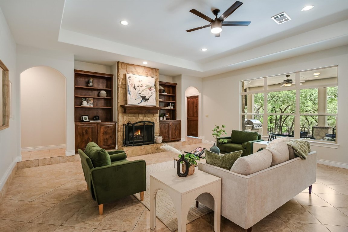 524 Highland Spring Lane Georgetown, TX 78633 - Photo 5 of 39 a living room with fireplace furniture and a large window