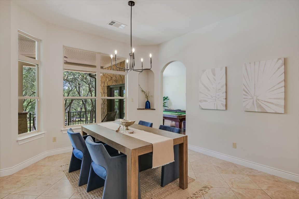 524 Highland Spring Lane Georgetown, TX 78633 - Photo 9 of 39 a view of a dining room with furniture window and wooden floor