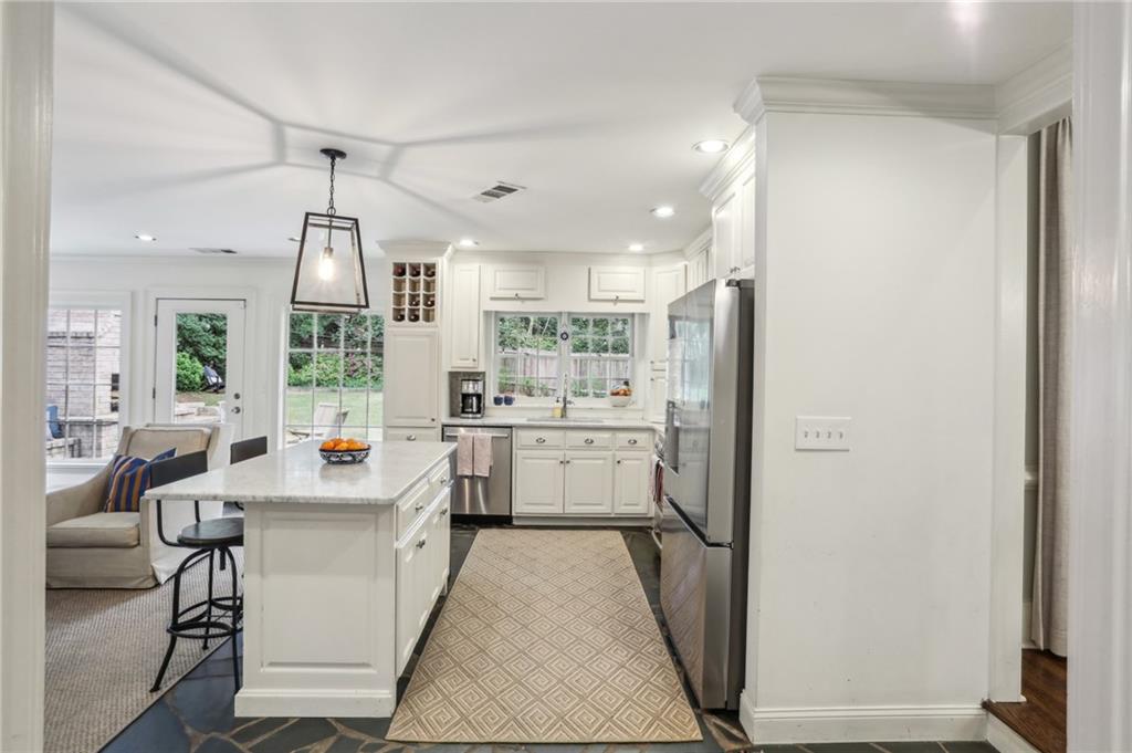 2415 Oldfield Road Northwest Atlanta, GA 30327 - Photo 11 of 27 a kitchen with sink cabinets and window