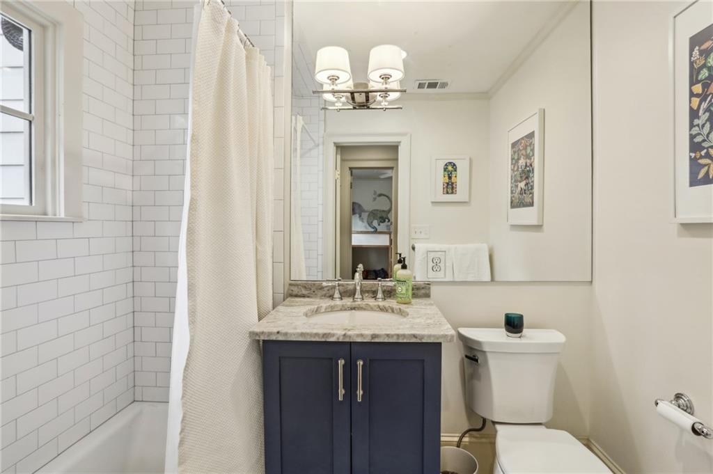 2415 Oldfield Road Northwest Atlanta, GA 30327 - Photo 18 of 27 a bathroom with a sink and a mirror