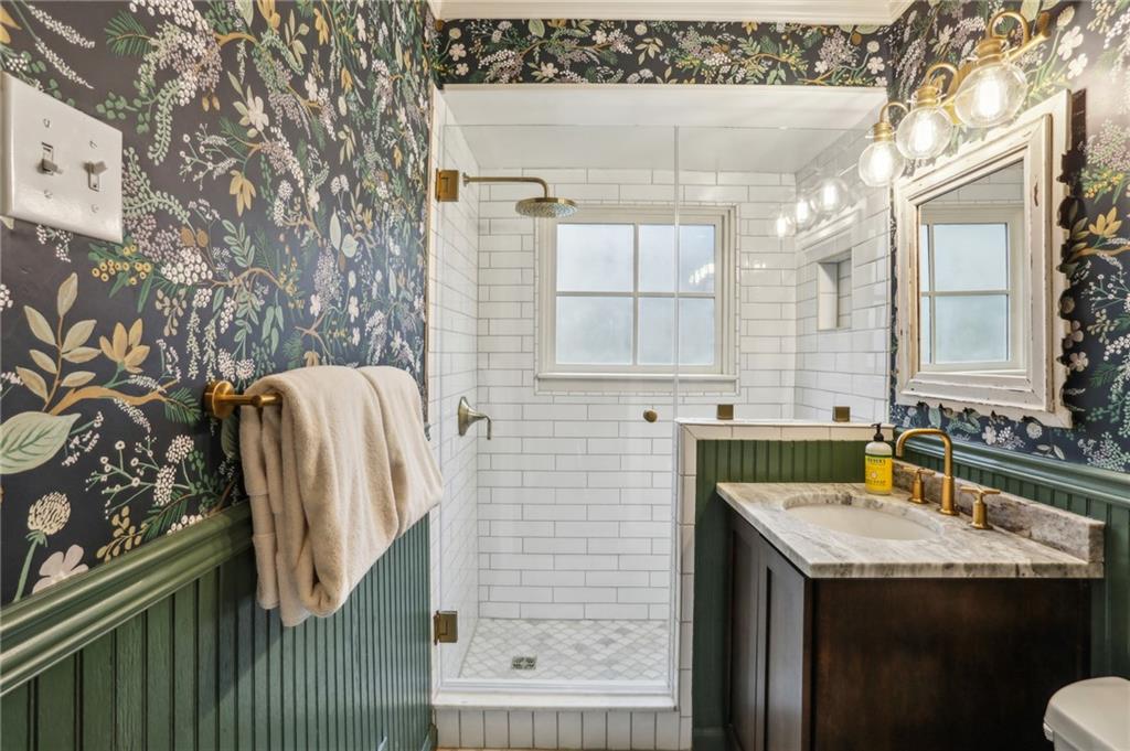 2415 Oldfield Road Northwest Atlanta, GA 30327 - Photo 27 of 27 a bathroom with a sink and a mirror