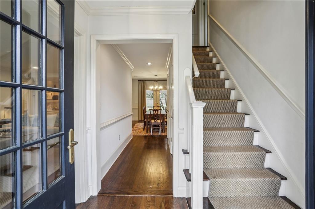 2415 Oldfield Road Northwest Atlanta, GA 30327 - Photo 4 of 27 a view of staircase with lots of frames on wall and windows