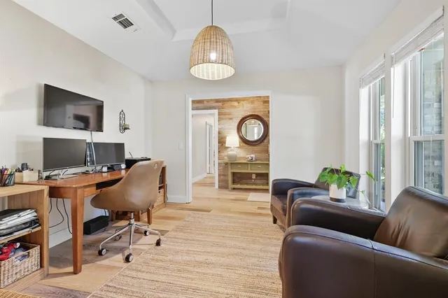 a kitchen with granite countertop a sink and a stove top oven