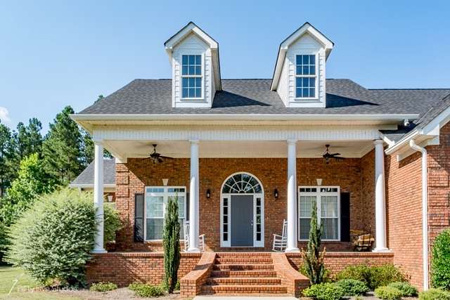 2575 Collier Road Forsyth, GA 31029 - Photo 2 of 25 front view of a house with a porch
