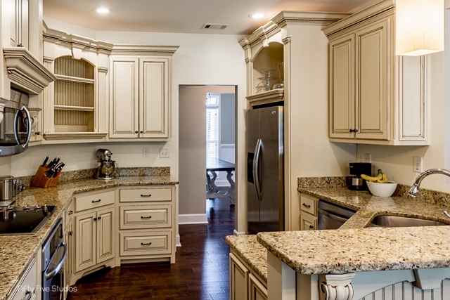 2575 Collier Road Forsyth, GA 31029 - Photo 11 of 25 a kitchen with granite countertop a refrigerator stove and sink