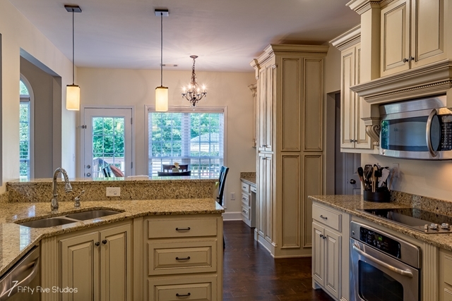 2575 Collier Road Forsyth, GA 31029 - Photo 12 of 25 a kitchen with a sink stove and refrigerator