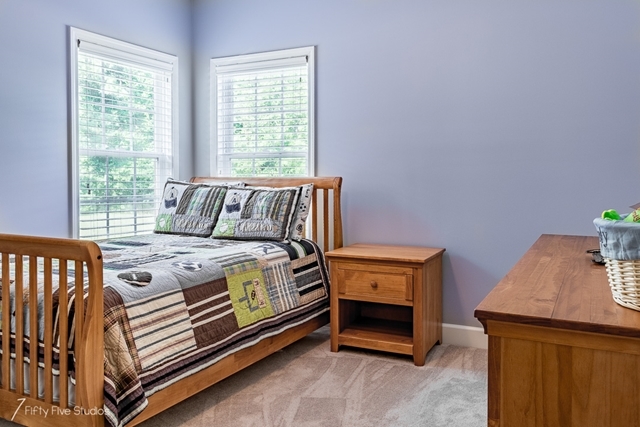 2575 Collier Road Forsyth, GA 31029 - Photo 15 of 25 a bedroom with a bed and a window