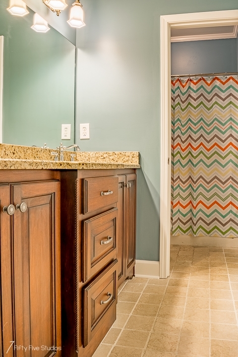 2575 Collier Road Forsyth, GA 31029 - Photo 17 of 25 a bathroom with a granite countertop sink and a mirror