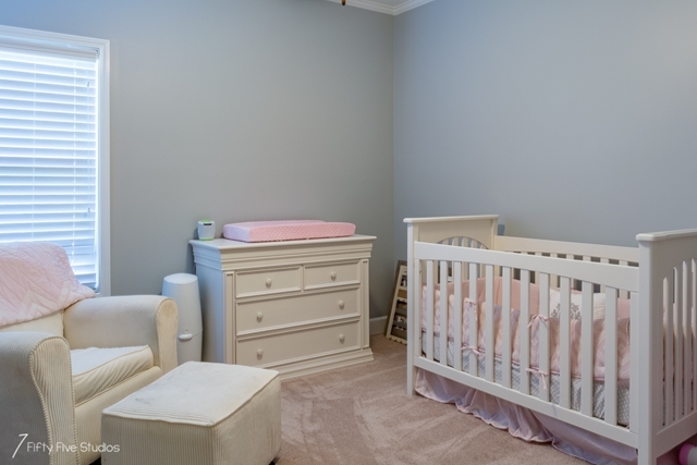 2575 Collier Road Forsyth, GA 31029 - Photo 18 of 25 a room with furniture a baby crib and a window