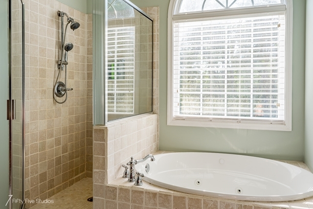 2575 Collier Road Forsyth, GA 31029 - Photo 20 of 25 a white bath tub sitting next to a window