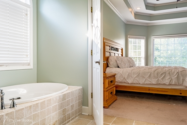 2575 Collier Road Forsyth, GA 31029 - Photo 22 of 25 a bedroom with a bed and a window