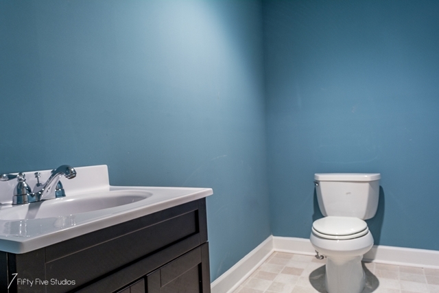 2575 Collier Road Forsyth, GA 31029 - Photo 25 of 25 a bathroom with a toilet a sink and mirror