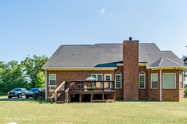 2575 Collier Road Forsyth, GA 31029 - Photo 4 of 25 a front view of a house with a garden