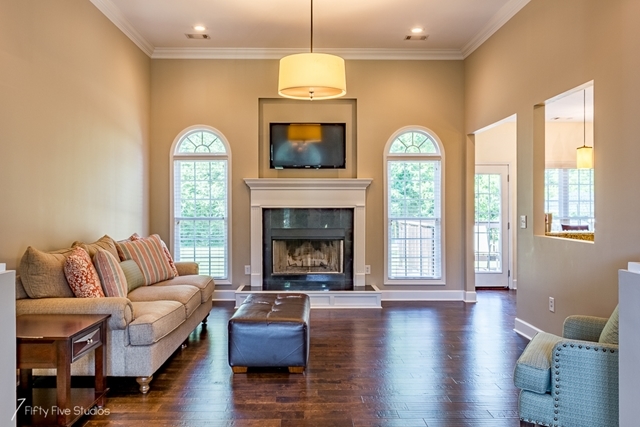 2575 Collier Road Forsyth, GA 31029 - Photo 6 of 25 a living room with fireplace furniture and a fireplace