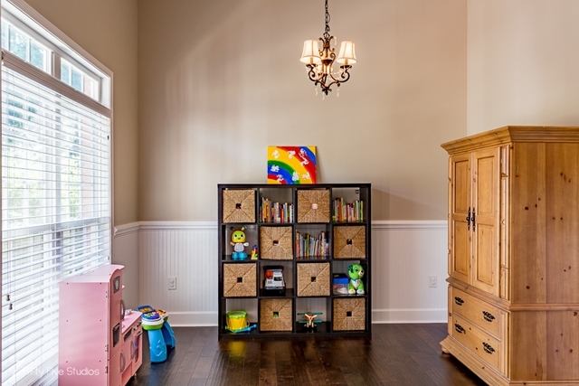 2575 Collier Road Forsyth, GA 31029 - Photo 9 of 25 a view of game room with window and wooden floor
