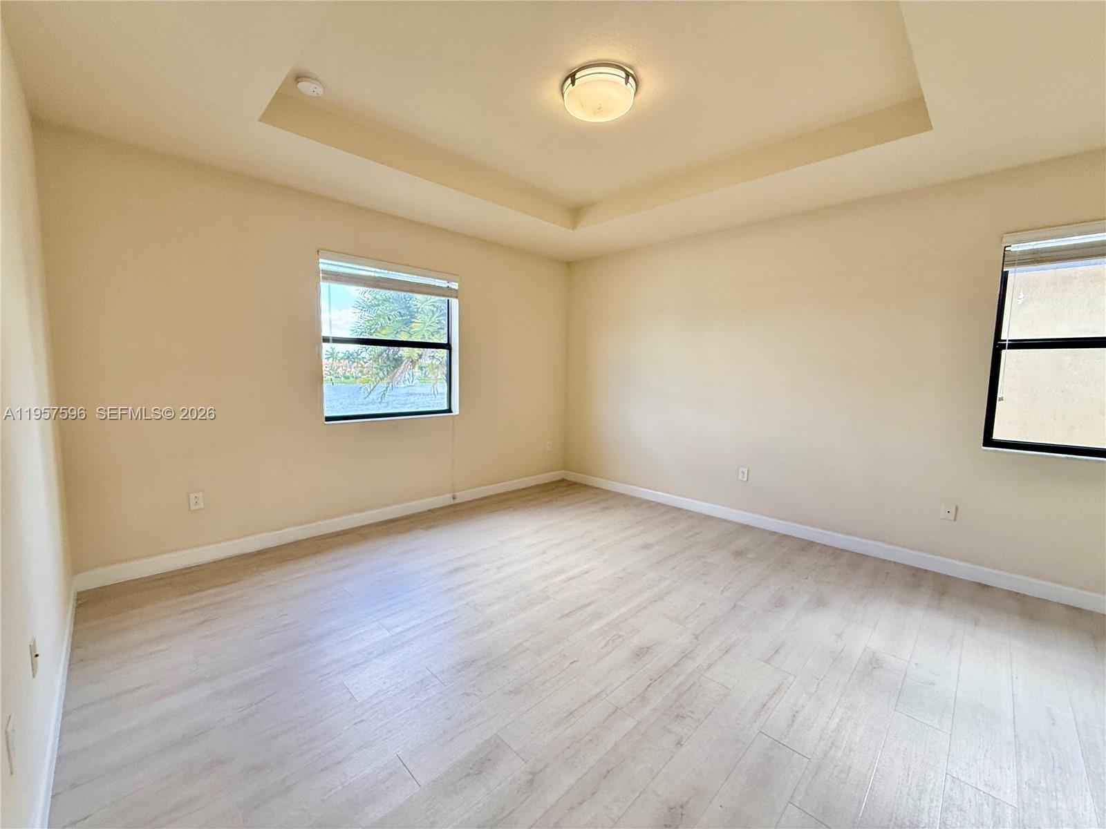 3385 West 86th Terrace, Unit 3385 Hialeah, FL 33018 - Photo 15 of 19 an empty room with windows