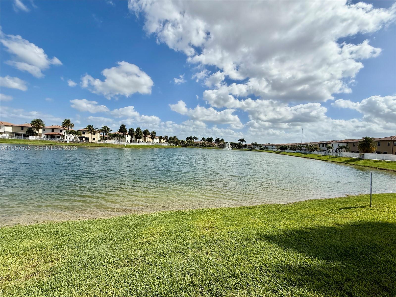 3385 West 86th Terrace, Unit 3385 Hialeah, FL 33018 - Photo 2 of 19 a view of a lake with a big yard
