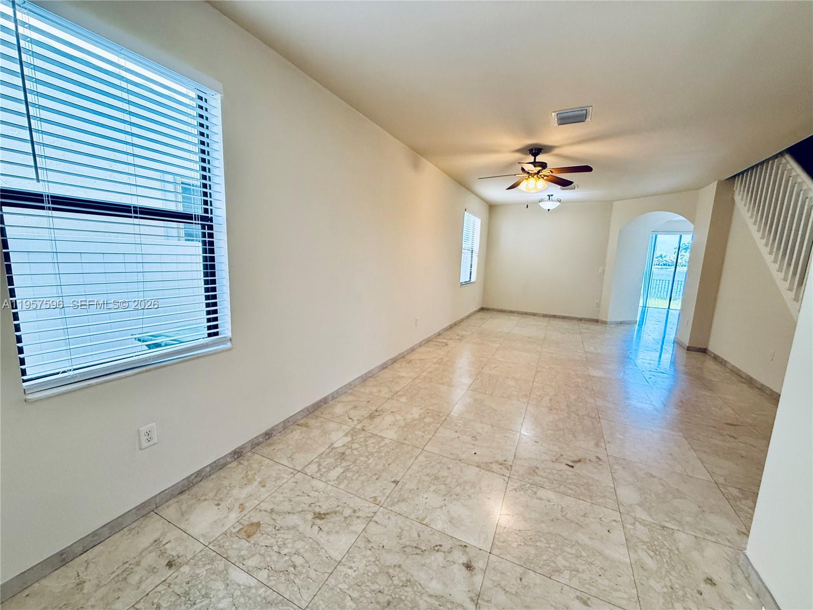3385 West 86th Terrace, Unit 3385 Hialeah, FL 33018 - Photo 3 of 19 a view of an empty room with a window