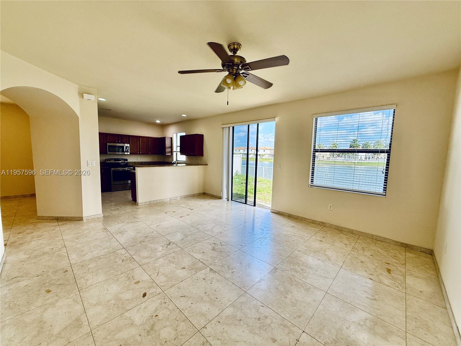 3385 West 86th Terrace, Unit 3385 Hialeah, FL 33018 - Photo 5 of 19 a view of a kitchen with a sink and a window