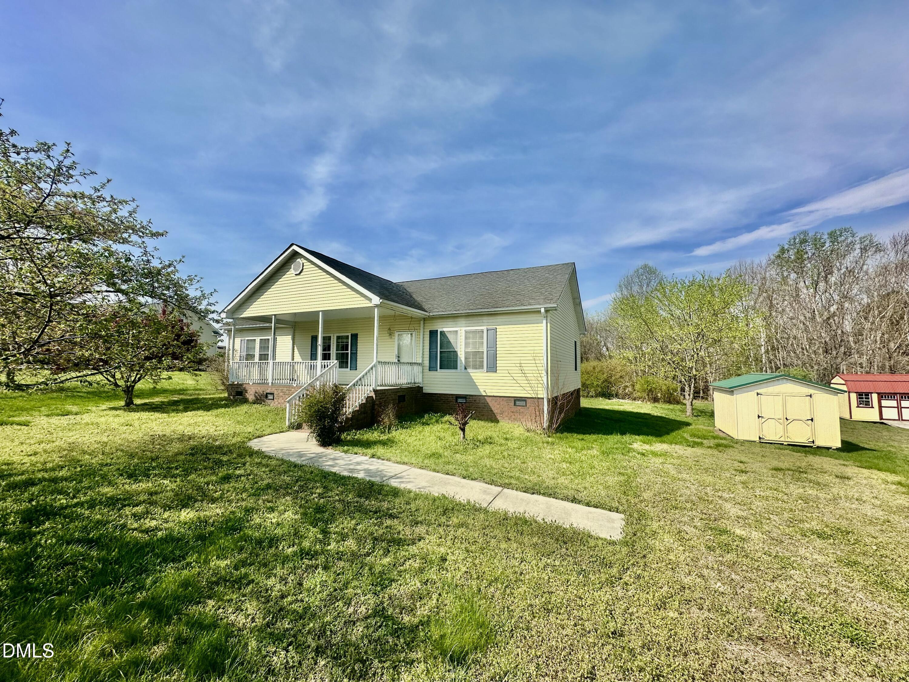 155 Collin Drive Roxboro, NC 27574 - Photo 20 of 20 a front view of a house with garden