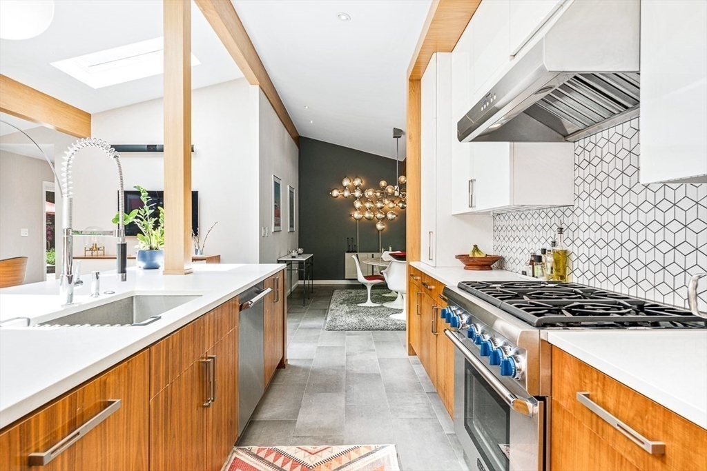 12 Alexandra Road Lynnfield, MA 01940 - Photo 11 of 42 a kitchen with stainless steel appliances a sink a stove and a wooden floors