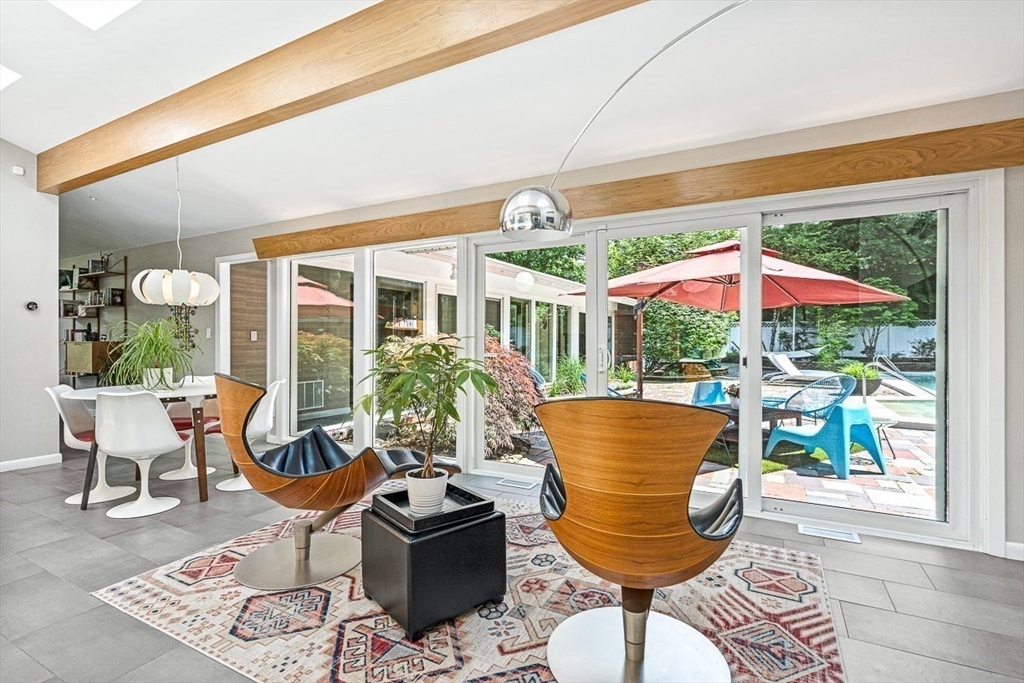 12 Alexandra Road Lynnfield, MA 01940 - Photo 14 of 42 a view of a dining room with furniture wooden floor and a chandelier