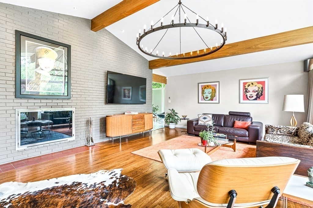 12 Alexandra Road Lynnfield, MA 01940 - Photo 15 of 42 a living room with fireplace furniture and a flat screen tv