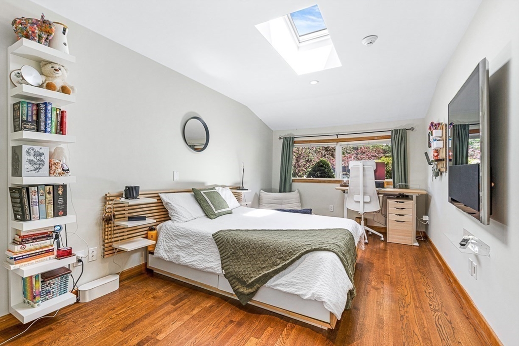 12 Alexandra Road Lynnfield, MA 01940 - Photo 21 of 42 a bedroom with a bed window and book shelf