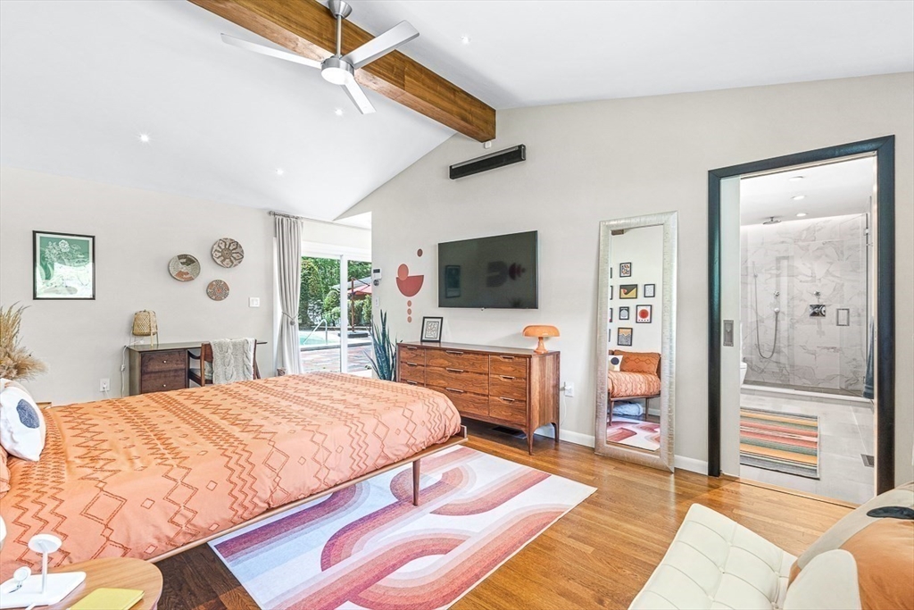 12 Alexandra Road Lynnfield, MA 01940 - Photo 27 of 42 a bedroom with a bed and a flat screen tv