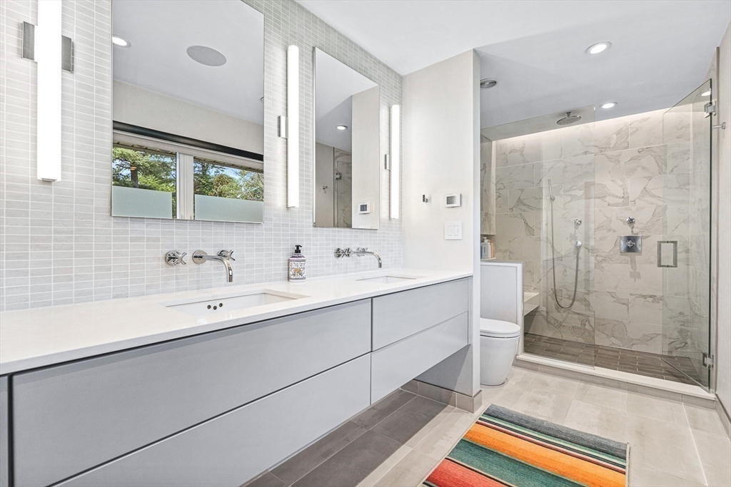 12 Alexandra Road Lynnfield, MA 01940 - Photo 28 of 42 a bathroom with a double vanity sink mirror and shower