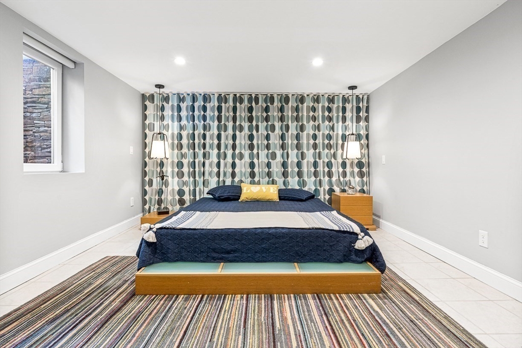 12 Alexandra Road Lynnfield, MA 01940 - Photo 32 of 42 a bed sitting in a room next to a window