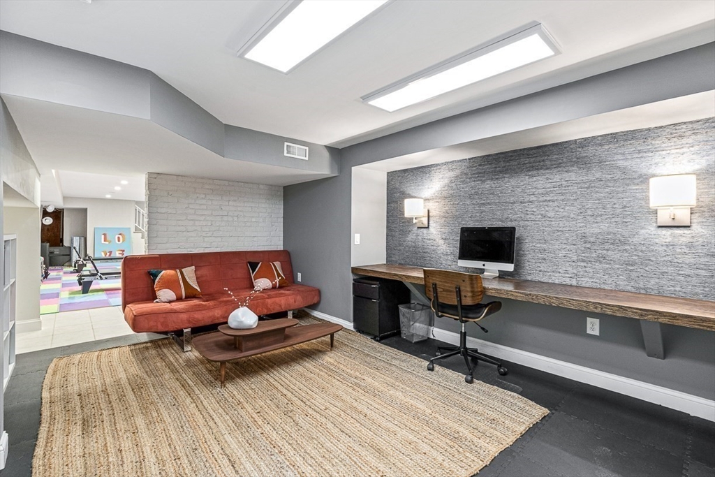 12 Alexandra Road Lynnfield, MA 01940 - Photo 33 of 42 a living room with furniture and a flat screen tv