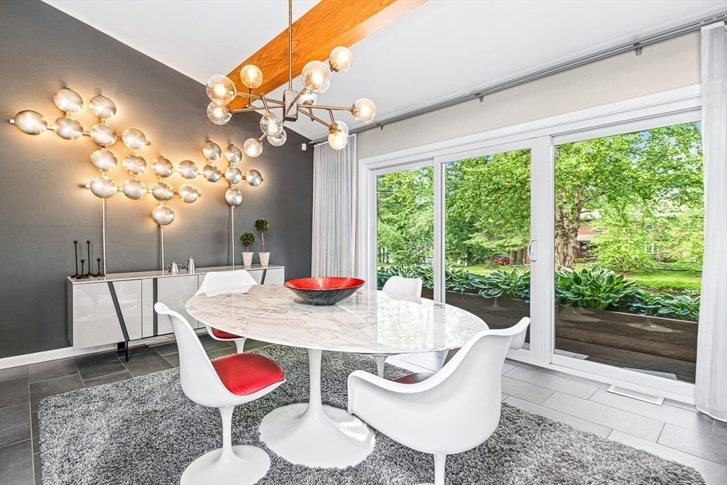 12 Alexandra Road Lynnfield, MA 01940 - Photo 7 of 42 a view of a dining room with furniture a chandelier and wooden floor