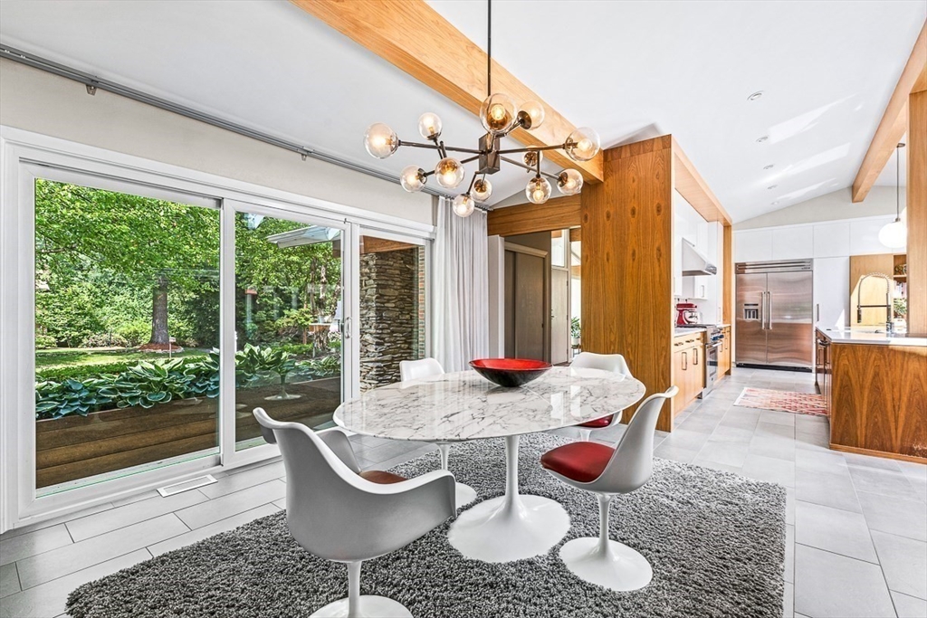 12 Alexandra Road Lynnfield, MA 01940 - Photo 8 of 42 a dining room with furniture a chandelier and wooden floor